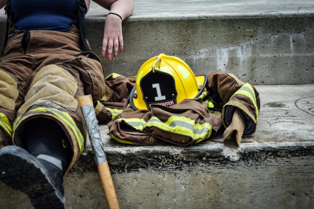 Fire fighter laying down exhausted